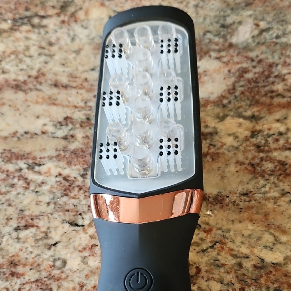 Black and Copper Electric Hairbrush uses low level laser light